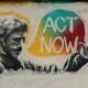 Mural of man saying 'Act Now'
