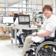 Person in a wheelchair working at a computer