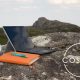 Photo of a laptop and notepad on a rock on the Moors