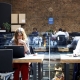 Image of people sat at desks in a co-working space